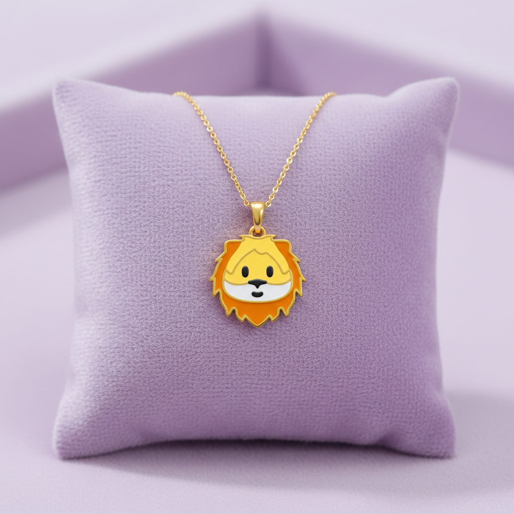 Extra small gold lion emoji pendant on lavender cushion