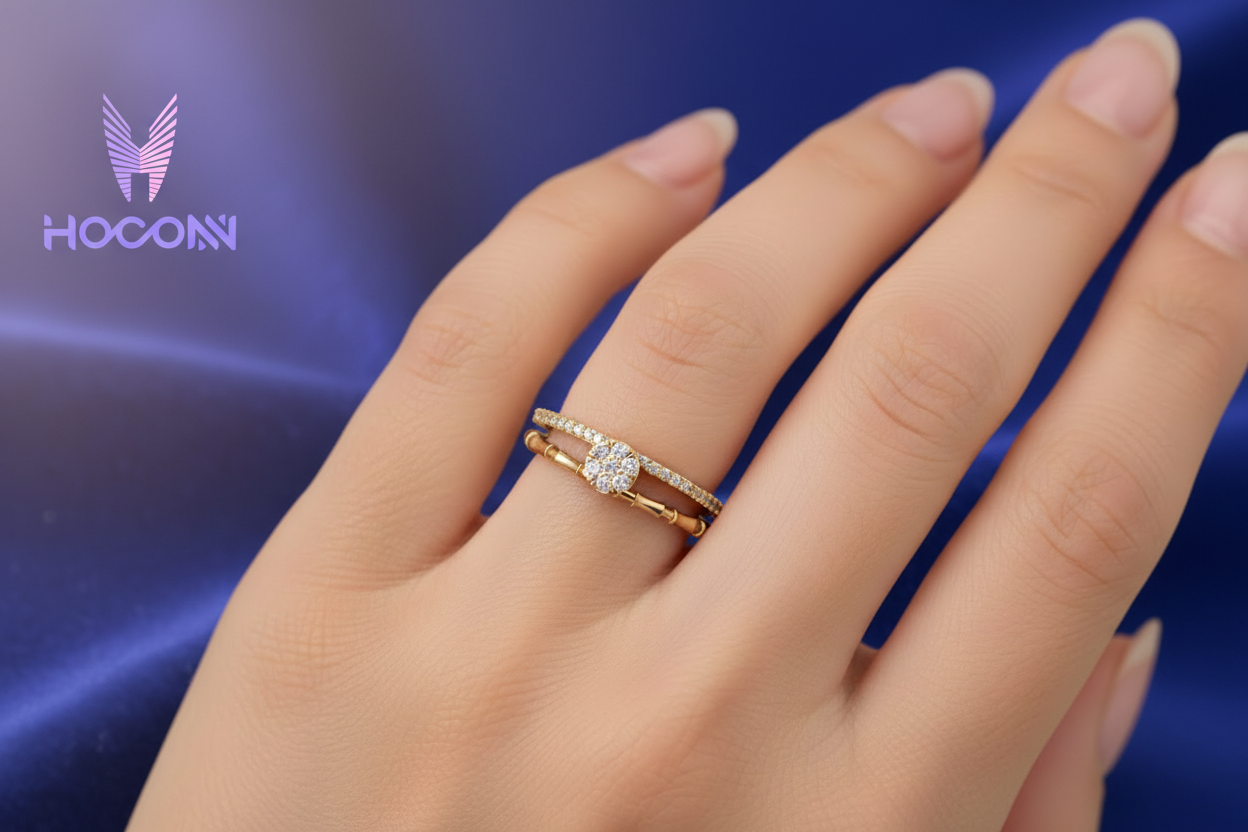 Girl wearing gold diamond ring with deep blue satin background