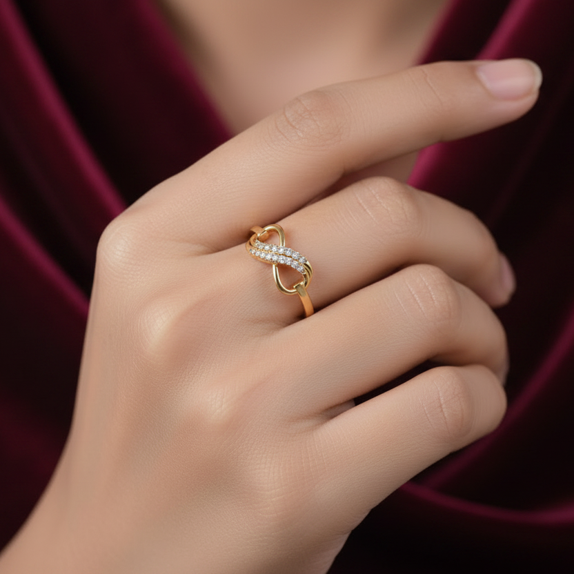 Girl wearing infinity diamond ring with maroon background