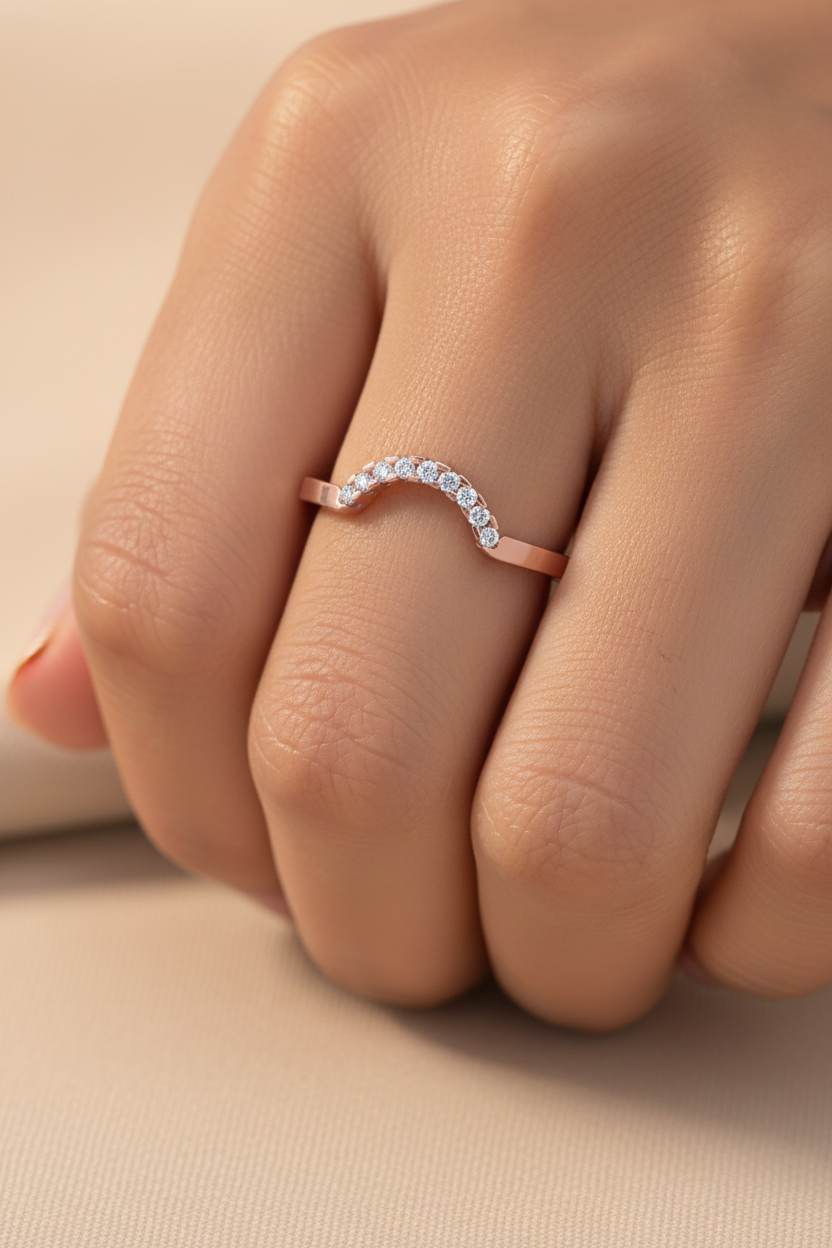Girl wearing rose gold curved diamond wedding band