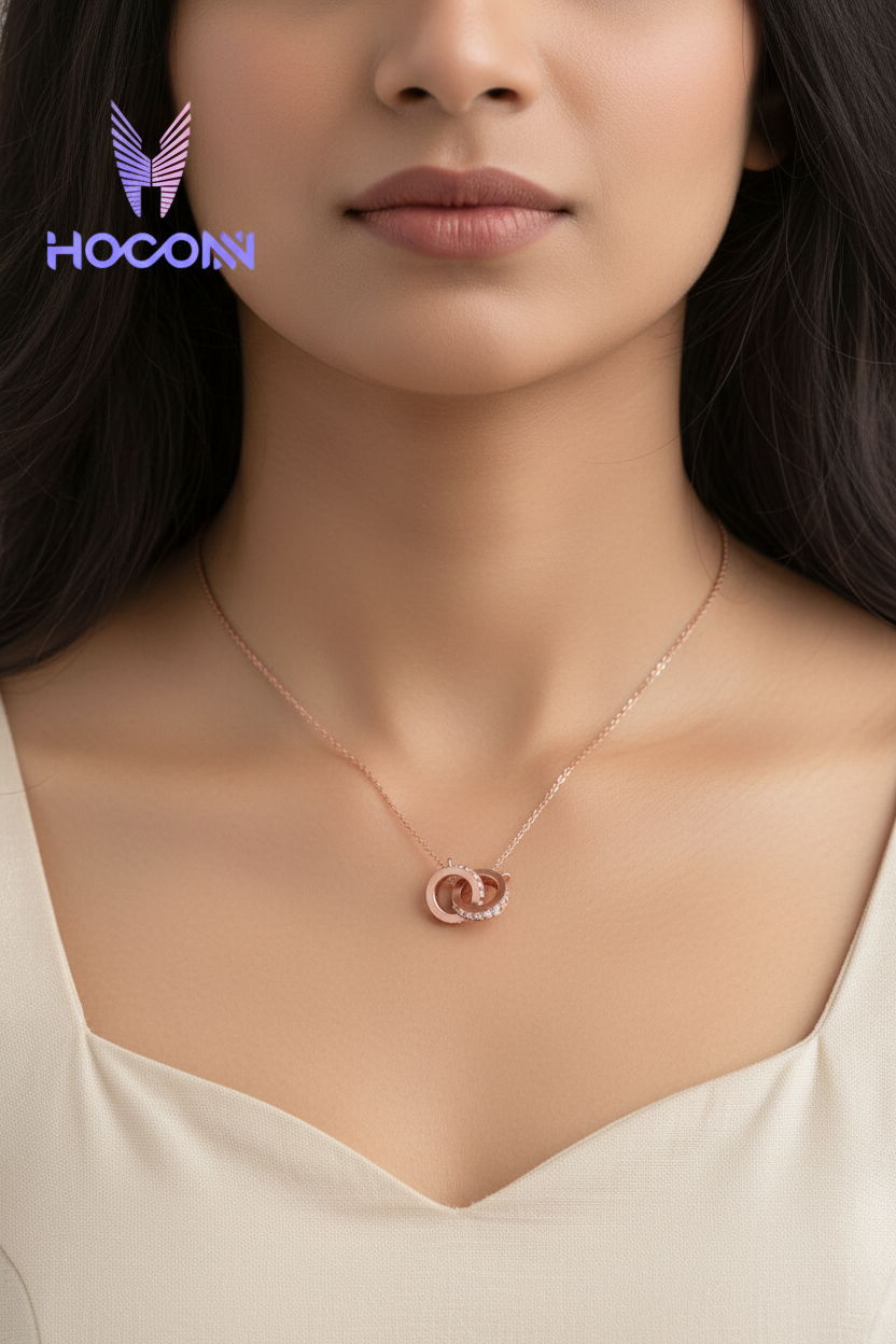 Indian woman front neck close-up zoomed with tiny rose gold interlocking circles diamond pendant