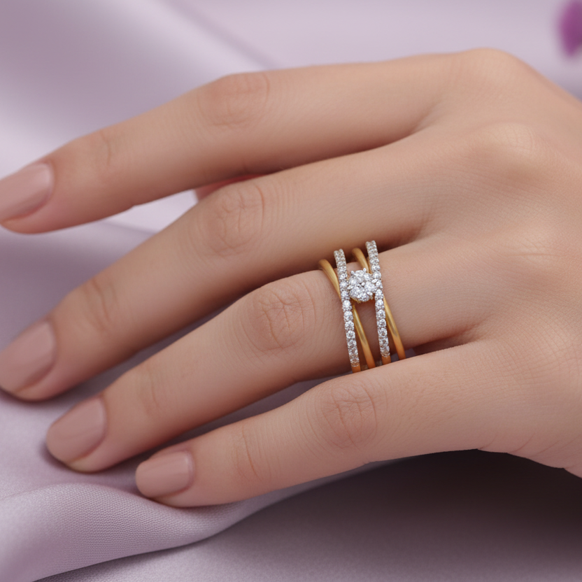 Model hand wearing yellow gold crossover ring