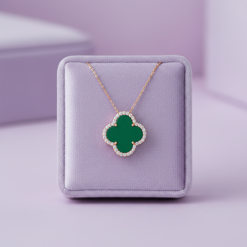 PDP1347C rose gold four-leaf clover matte green pendant very wide zoomed out shot on lavender velvet cushion