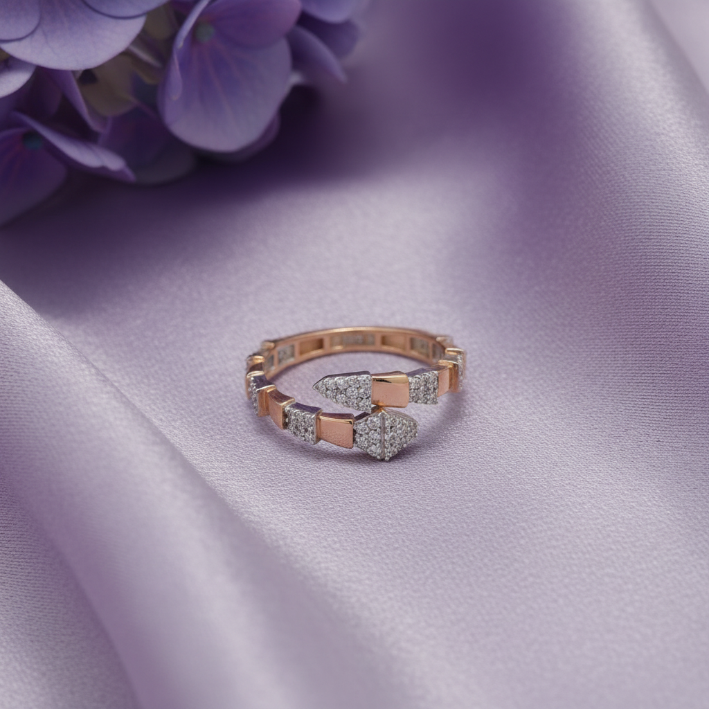 Rose gold bypass snake ring flat lay