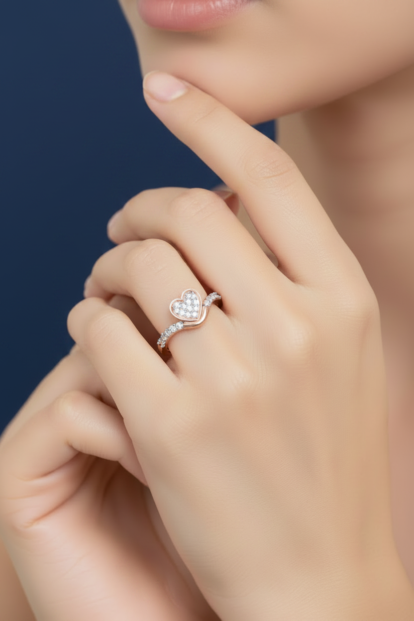 Rose gold heart ring on deep blue background