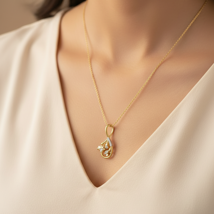 Woman wearing extra small CPD00237 yellow gold infinity loop floral pendant with long chain