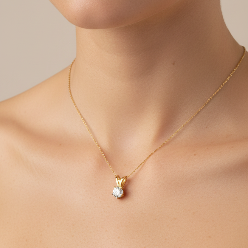Woman wearing extra small gold solitaire diamond pendant