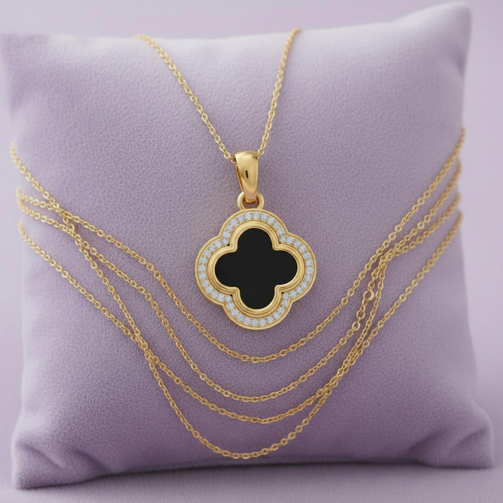 Yellow gold black onyx clover diamond pendant with multiple chains on lavender cushion