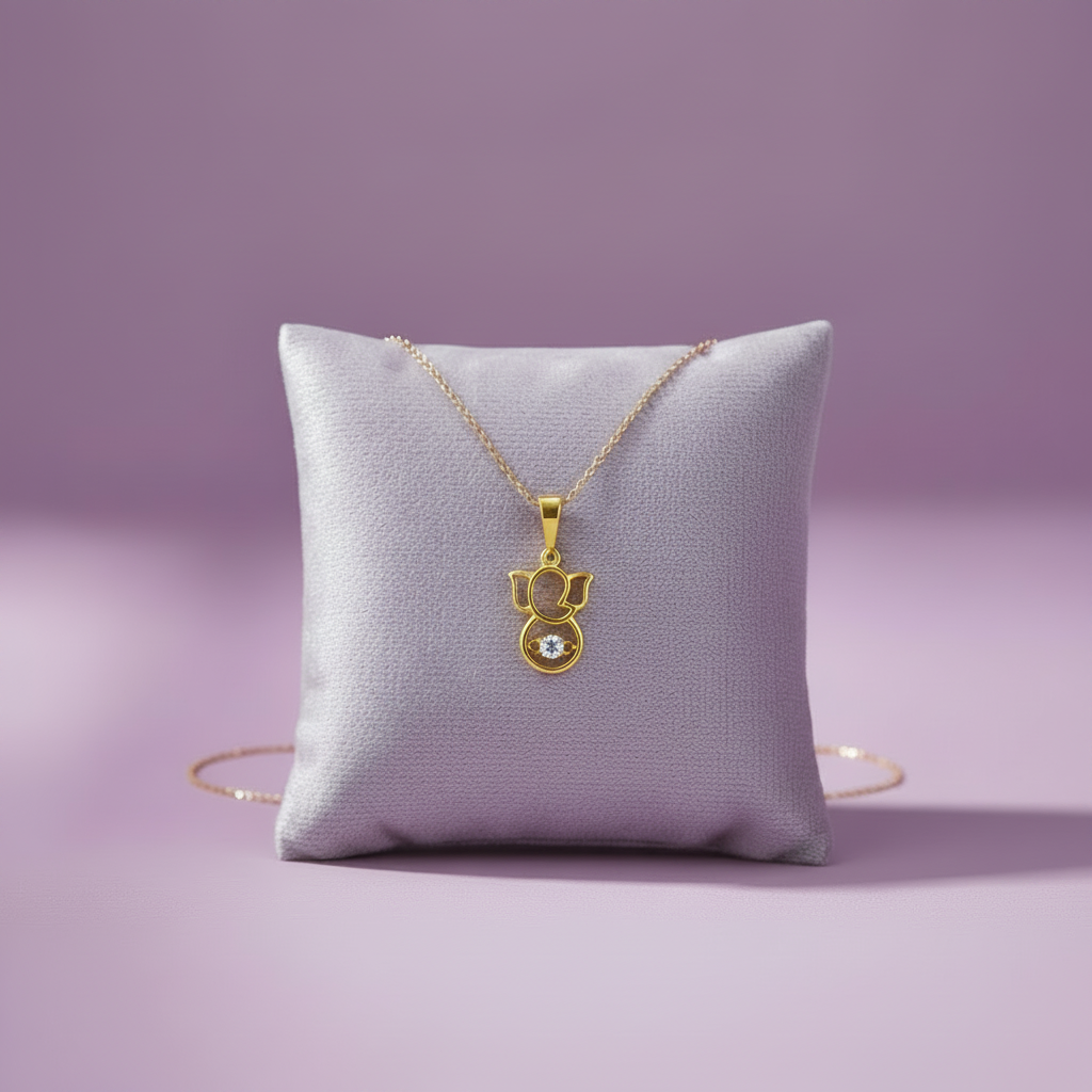 Yellow Gold Ganesha Pendant on Lavender Cushion